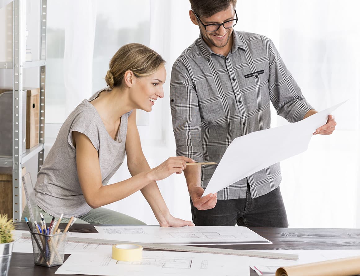 A happy couple scheduling their appointment